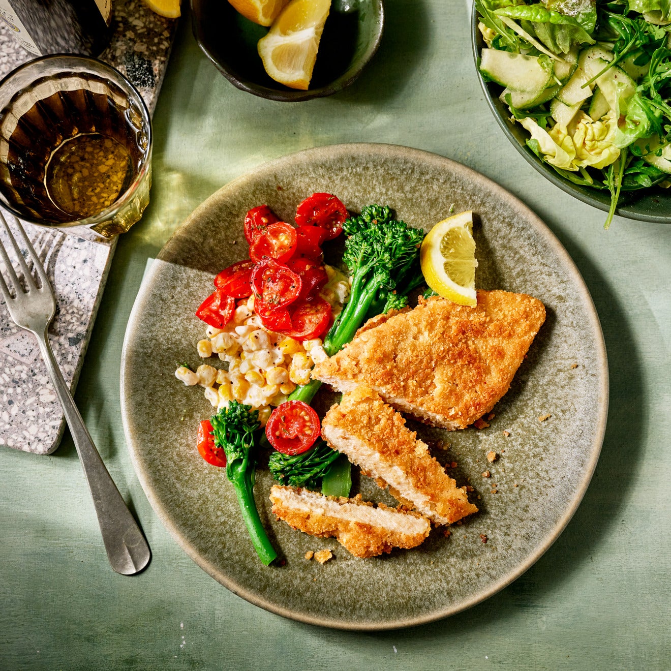 Vegan Schnitzel with Creamed Corn, Fried Cherry Tomatoes, and Broccolini Vegan Schnitzel with Creamed Corn, Fried Cherry Tomatoes, and Broccolini