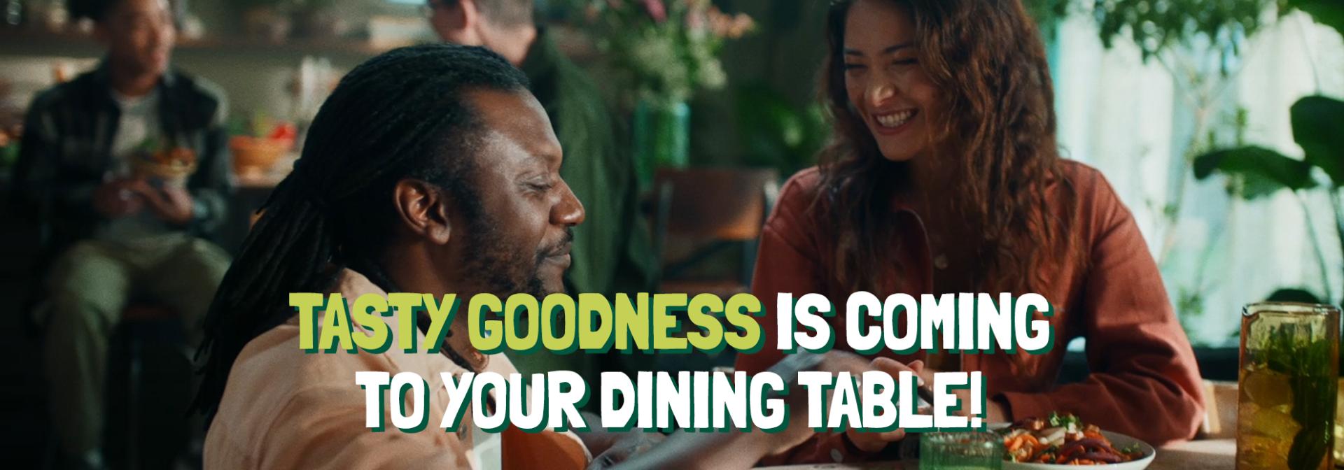 Header of the Article named "Tasty goodness is coming to your dining table" with people in the background