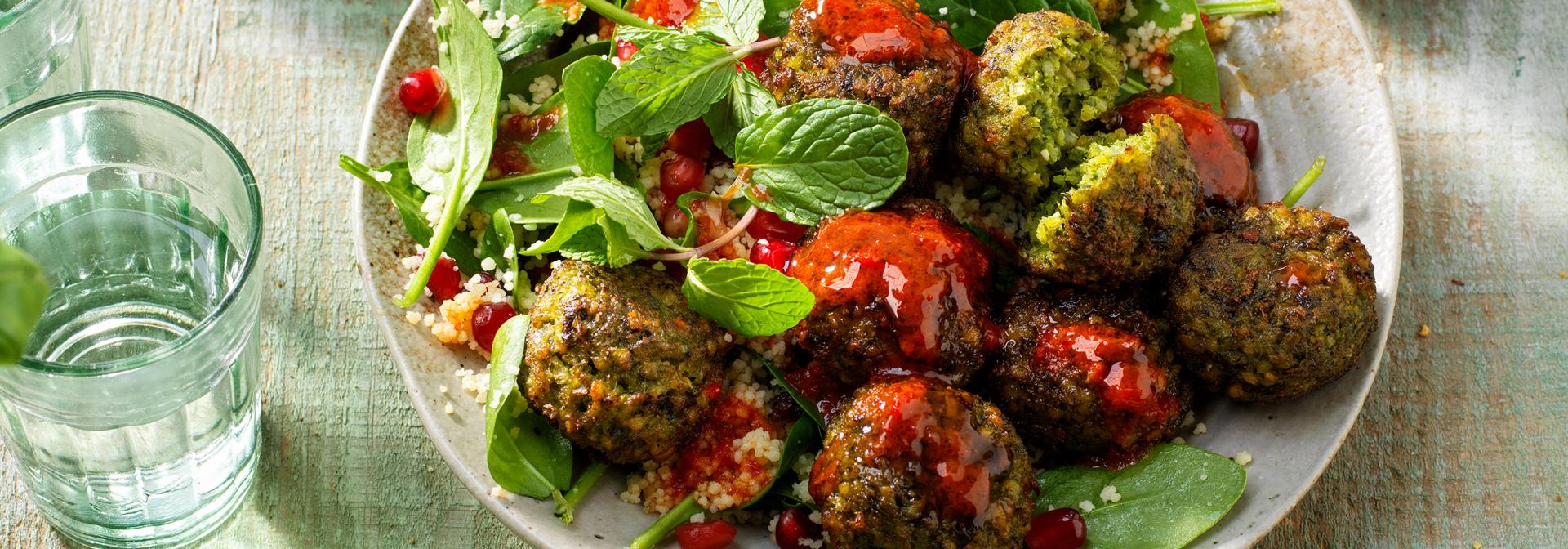 Quinoa salad with falafel spinach