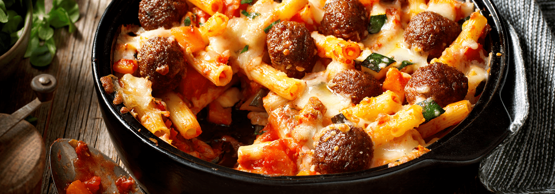 Gratinated pasta with pumpkin and veggie balls