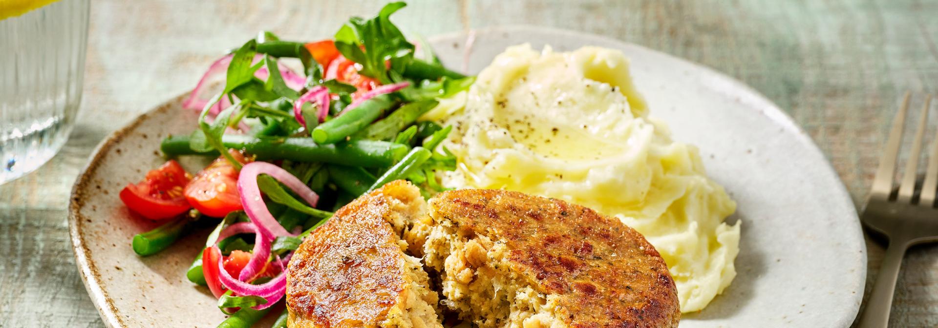 Creamy mashed potatoes and green beans salad with vegan Frikadelle
