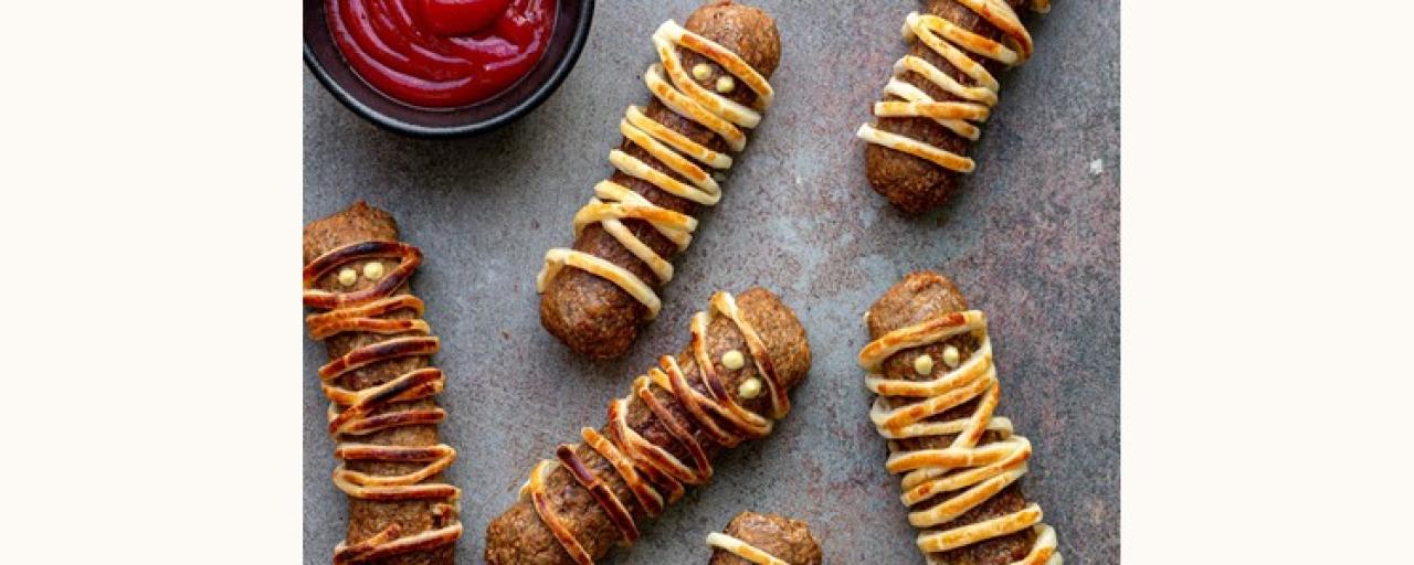 Sensational Sausage, covered in dough, looking like a mummy