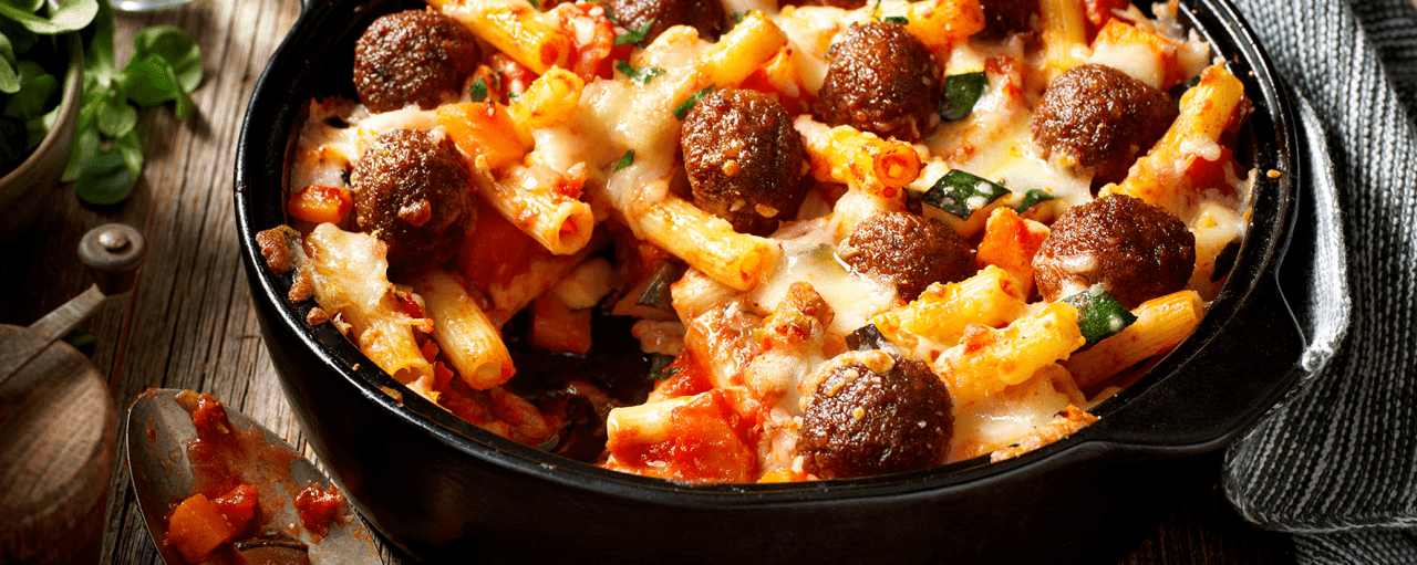 Gratinated pasta with pumpkin and veggie balls