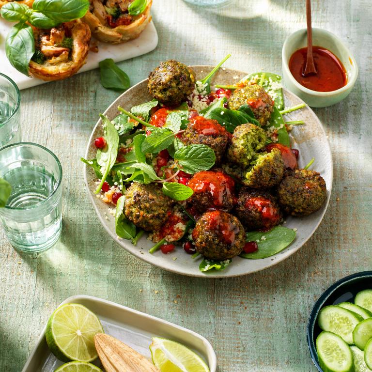 Quinoa salad with falafel spinach
